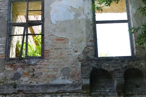 Two old broken windows in castle Stock Photos
