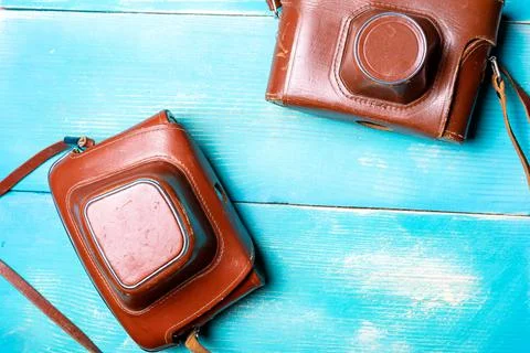 Two old cameras in leather brown covers Stock Photos