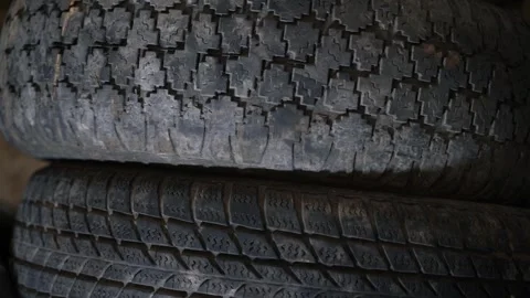 Two old car tires with different tire patterns. The difference between hard and Stock Footage 245132169