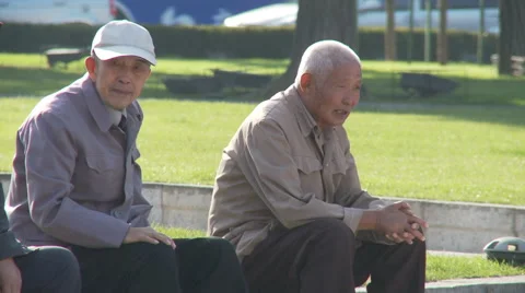 Two old Chinese men sitting in park, China Stock Footage 54444465
