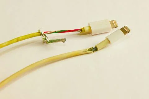 Two old damaged wire from the phone charger Stock Photos