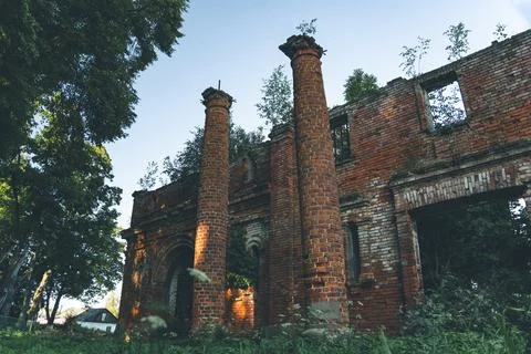 Two old, dilapidated, brick columns, at the entrance to the stable Stock Photos