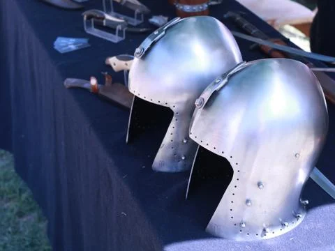 Two old helmets on the table Stock Photos