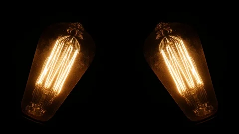 Two Old Light Bulbs Glowing Filament And Turn Off Video stock 96883790