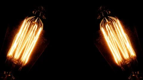 Two Old Light Bulbs With Glowing Filaments Stock Photos