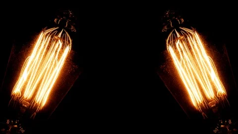 Two Old Light Bulbs Very Close Glowing Filament And Turn Off Video stock 96883878