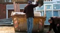 Two old men filling a skip HD Footage