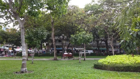 Two old men sitting together on a bench in a park, day time 스톡 동영상 125318148