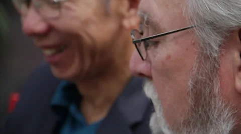 Two old men talking to each other as they work in ipad Stock Footage 36164751