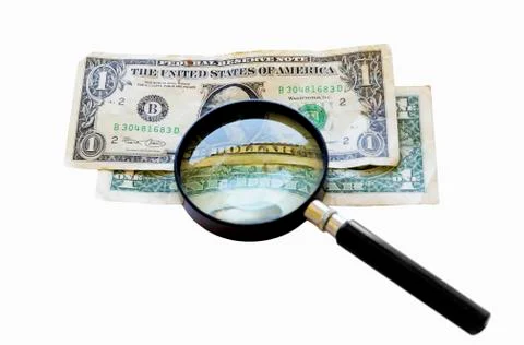 Two old one dollar bills under a magnifying glass Stock Photos