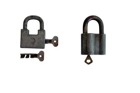 Two old padlocks with keys. Isolated image on white background Stock Photos