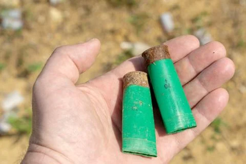 Two old rusty gun case on the palm Stock Photos