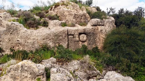 Two Old Semitic (Phoenician) letters carved in the rock 库存影片 113143389