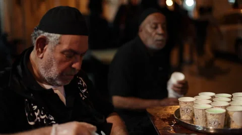Two old shia men distributing beverages during Day of Ashura Vídeo Stock 56379936