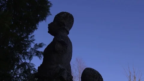 Two Old Stone Statues Stand on an Eminence Stock Footage 73498176