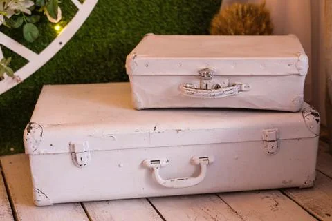 Two old suitcase stacked with different size Stock Photos