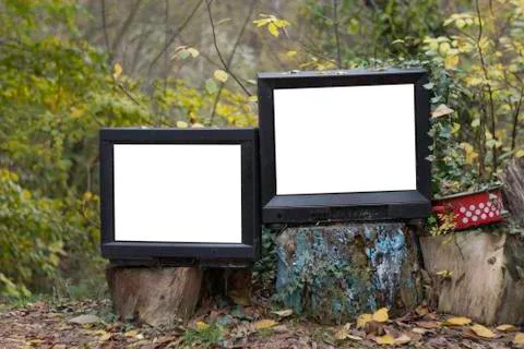 Two old television in the forest Stock Photos