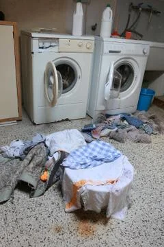 Two old white washing machine in the attic with many dirty rags Фото