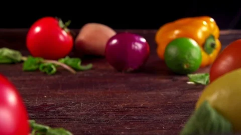 Two onions are moving toward each other on a table. Seasonal vegetables on the t Stockbeeldmateriaal 72387009