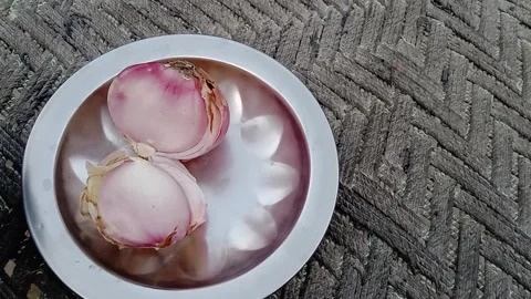 Two Onions Placed on a Plate Video stock 347758174