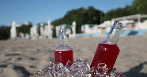 Two open bottles of red drink Stock Footage 148316182