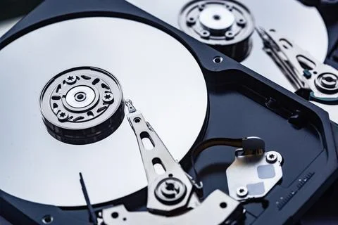 Two open computer hard drives for repair. Data safety concept. Stock Photos