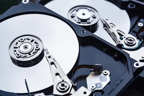 Two open computer hard drives for repair. Data safety concept. Stock Photos