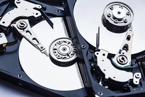 Two open computer hard drives for repair. Data safety concept. Stock Photos