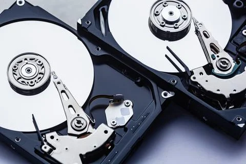 Two open computer hard drives for repair. Data safety concept. Stock Photos