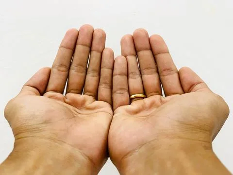 Two open palms held together asking for blessing, charity, and hope concept Stock Photos