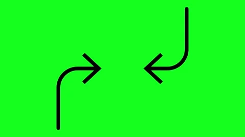 Two opposing arrows point left and right against a solid green background Stock Footage 346377458