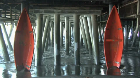 Two Orange Canoes Under the Santa Monica Pier Stock Footage 33735857