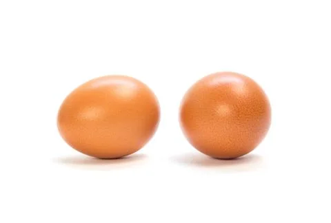 Two orange chicken eggs. Close up. Isolated on white background Foto stock