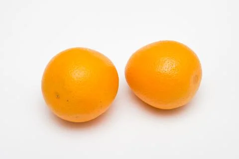 Two orange fruit isolated on white backgrounds Stock Photos