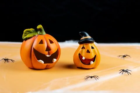 Two orange pumpkins on a black background. Halloween Foto stock