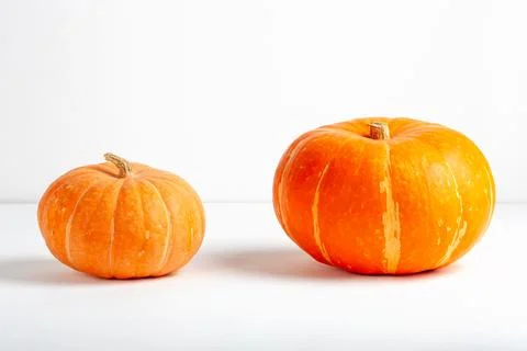 Two orange pumpkins on white background Stock Photos