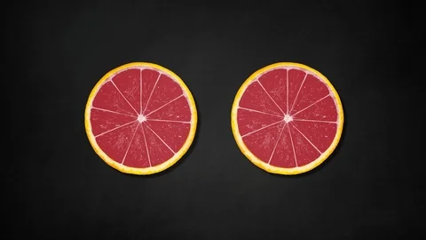 Two orange slices rotating on black board background - animation Stock Footage 109196646
