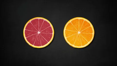 Two orange slices rotating on black board background - animation Stock Footage 109196811