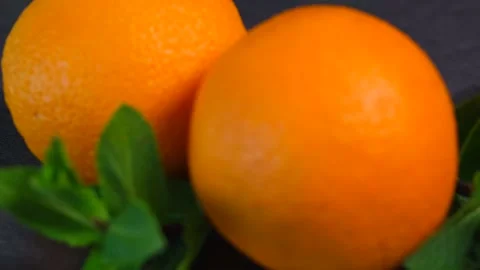Two oranges on a dark background Stock Footage 154236717