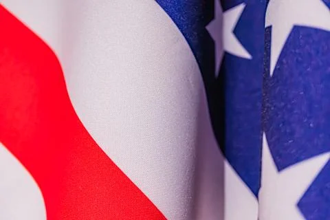 Two overlapping American flags, vibrant colors red, white, blue, layered ri.. Stock Photos