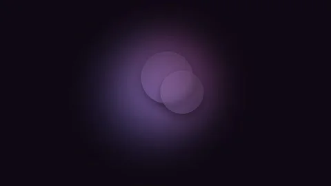Two overlapping purple circles glowing against a dark black background Stockbeeldmateriaal 338310234