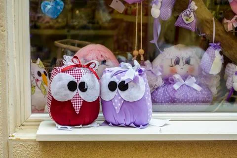 Two owls Plush  sitting in a window. Stock Photos