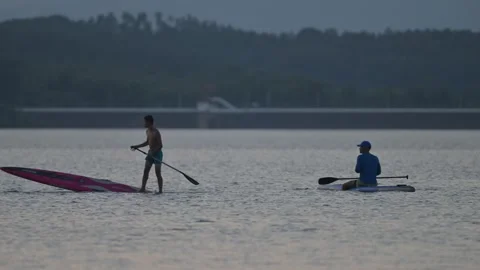 Two Paddleboarders on Lake Evening Stock-Footage 345041045