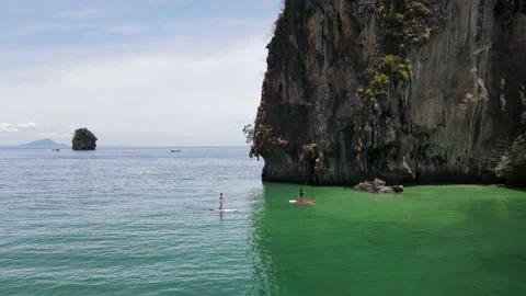 Two paddlers at the beach Stock Footage 194385017