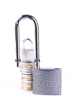 Two padlocks and a stack of coins Stock Photos