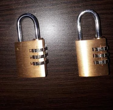 Two padlocks with numerical codes Stock Photos