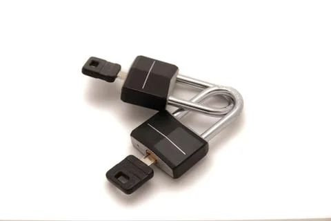 Two padlocks white background isolation - peace of mind Stock Photos