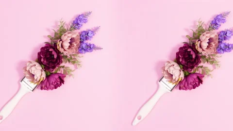 Two paint brushes move and leave flowers behind. Stop motion Video stock 150270050