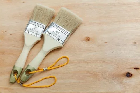 Two paint brushes, Views isolated on plywood, Backgrounds Stock Photos