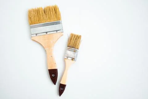 Two paintbrushes on white background with copy space Stock Photos